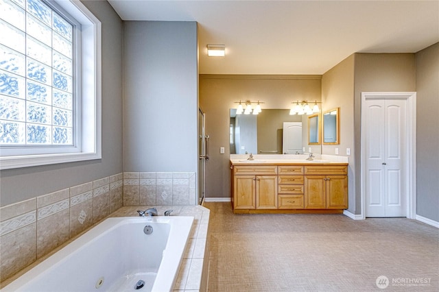 120 Petal Ln, Sequim, WA 98382 - bathroom featuring plenty of natural light, double vanity, and a tub with jets