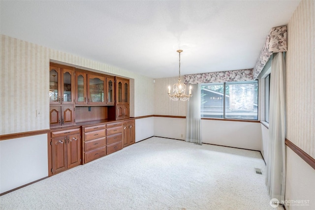 3524 SW 325th St, Federal Way, WA 98023 - unfurnished dining area featuring wallpapered walls, light colored carpet, and a chandelier