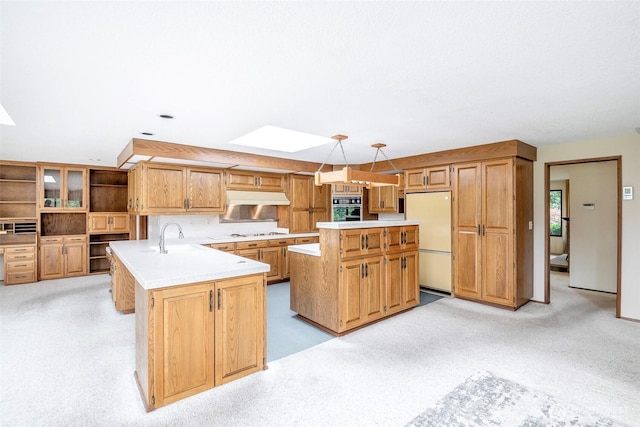 3524 SW 325th St, Federal Way, WA 98023 - kitchen featuring freestanding refrigerator, black oven, a skylight, and light countertops