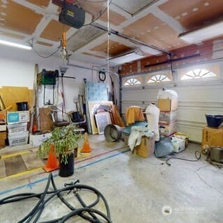 8405 220th St SW, Edmonds, WA 98026 - garage featuring a garage door opener