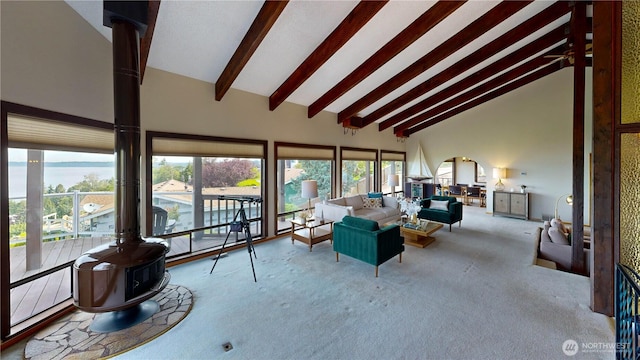 29417 1st Ave S, Federal Way, WA 98003 - sunroom with carpet, high vaulted ceiling, beam ceiling, a wood stove, and plenty of natural light
