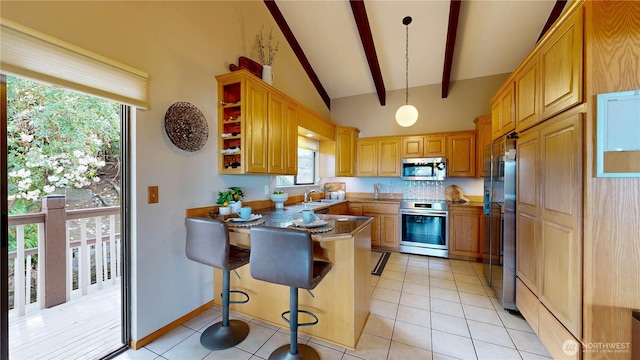 29417 1st Ave S, Federal Way, WA 98003 - kitchen featuring stainless steel appliances, a peninsula, a kitchen breakfast bar, light tile patterned floors, and decorative light fixtures