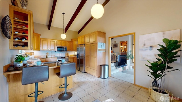 29417 1st Ave S, Federal Way, WA 98003 - kitchen featuring appliances with stainless steel finishes, high vaulted ceiling, beam ceiling, a peninsula, and light tile patterned floors