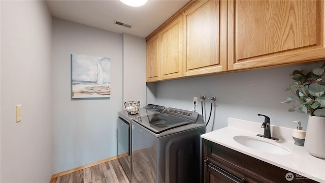 29417 1st Ave S, Federal Way, WA 98003 - laundry area with washer and clothes dryer, cabinet space, and wood finished floors