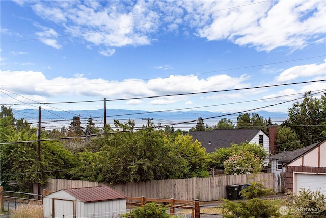 727 E 11th St, Port Angeles, WA 98362 - view of yard featuring a storage unit and a mountain view
