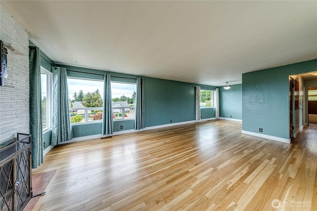 727 E 11th St, Port Angeles, WA 98362 - unfurnished living room with light wood-style flooring
