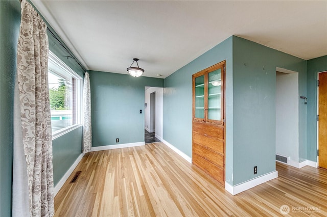 727 E 11th St, Port Angeles, WA 98362 - empty room featuring wood finished floors and baseboards