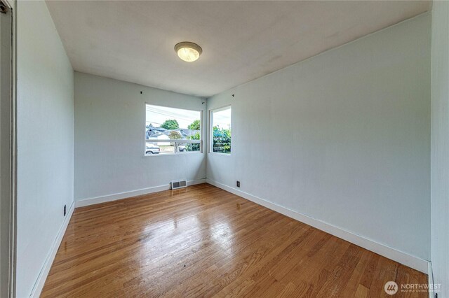 727 E 11th St, Port Angeles, WA 98362 - unfurnished room with wood finished floors and baseboards