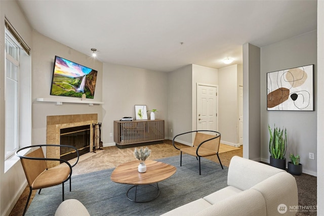 18930 Bothell Everett Hwy Unit F105, Bothell, WA 98012 - carpeted living room featuring a tiled fireplace and baseboards