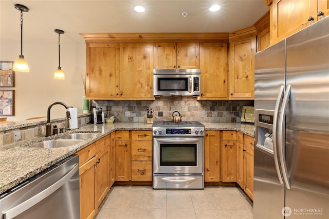 3770 Suncadia Trl Unit 309, Cle Elum, WA 98922 - kitchen featuring appliances with stainless steel finishes, backsplash, light tile patterned floors, decorative light fixtures, and recessed lighting