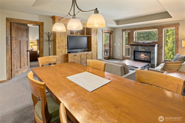 3770 Suncadia Trl Unit 309, Cle Elum, WA 98922 - carpeted dining area featuring a raised ceiling and a tiled fireplace