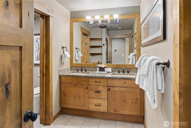 3770 Suncadia Trl Unit 309, Cle Elum, WA 98922 - bathroom featuring double vanity, a chandelier, and tile patterned floors