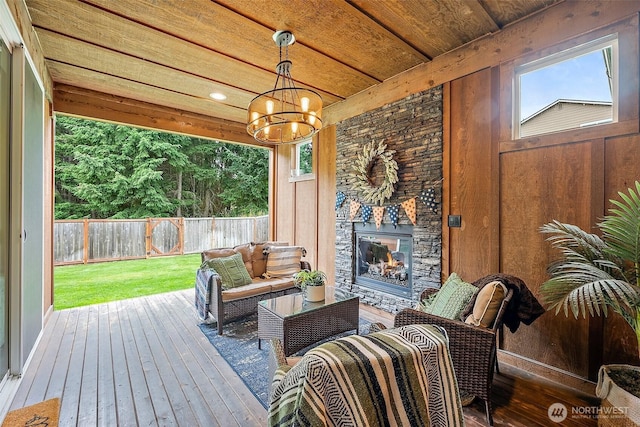 19537 207th Street Ct E, Orting, WA 98360 - deck with a fenced backyard and an outdoor living space with a fireplace