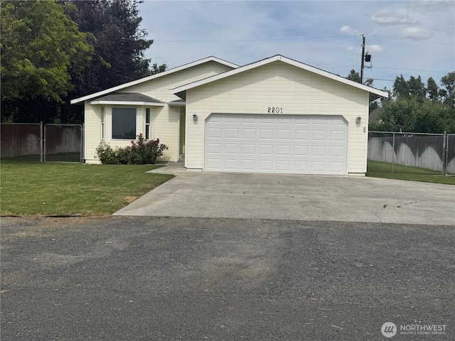 2201 Elgin Rd NE, Moses Lake, WA 98837 - ranch-style house with driveway and an attached garage