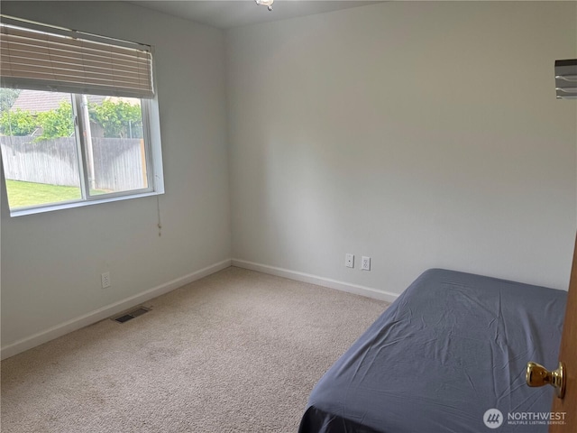 2201 Elgin Rd NE, Moses Lake, WA 98837 - unfurnished bedroom with baseboards and carpet flooring