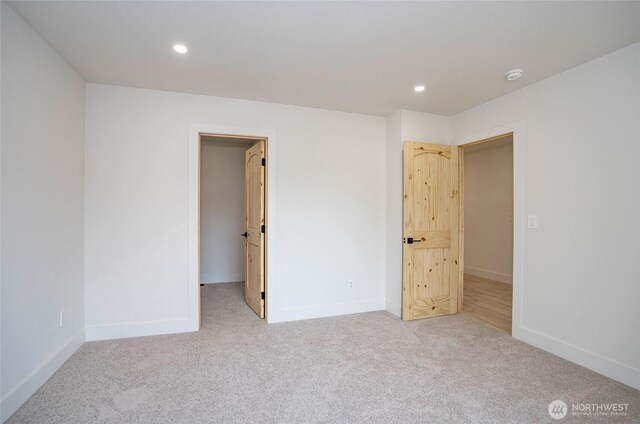6203 119th St E, Puyallup, WA 98373 - unfurnished bedroom featuring carpet, a spacious closet, and recessed lighting