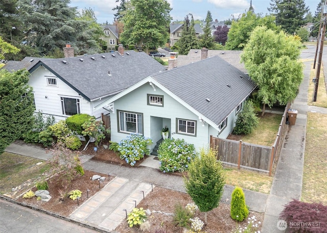406 N Cushman Ave, Tacoma, WA 98403 - view of front of house featuring roof with shingles and a chimney