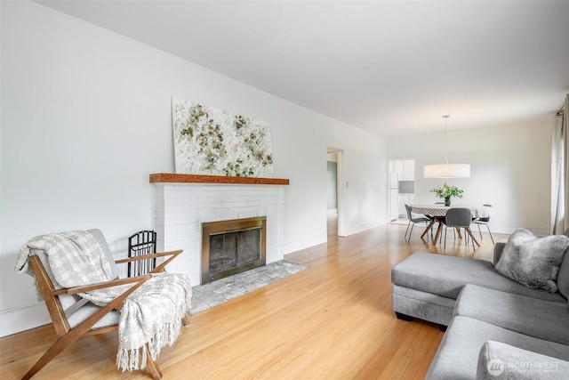 406 N Cushman Ave, Tacoma, WA 98403 - living area featuring light wood finished floors and a fireplace