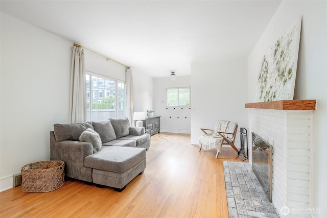 406 N Cushman Ave, Tacoma, WA 98403 - living area with light wood-type flooring and a fireplace