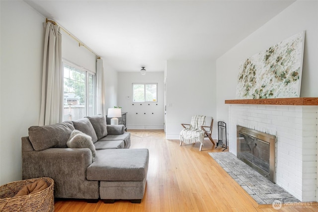 406 N Cushman Ave, Tacoma, WA 98403 - living room with a fireplace and light wood-style flooring