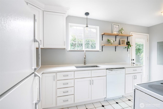 406 N Cushman Ave, Tacoma, WA 98403 - kitchen featuring white appliances, healthy amount of natural light, white cabinetry, and light countertops