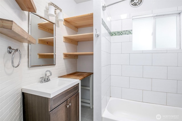 406 N Cushman Ave, Tacoma, WA 98403 - bathroom featuring decorative backsplash, vanity, and bathing tub / shower combination