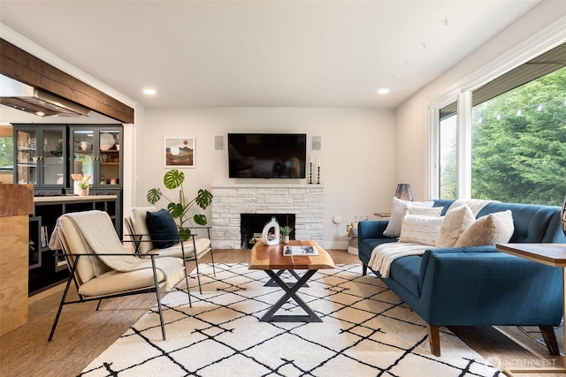 11803 14th Ave S, Seattle, WA 98168 - living room with wood finished floors, recessed lighting, and a stone fireplace