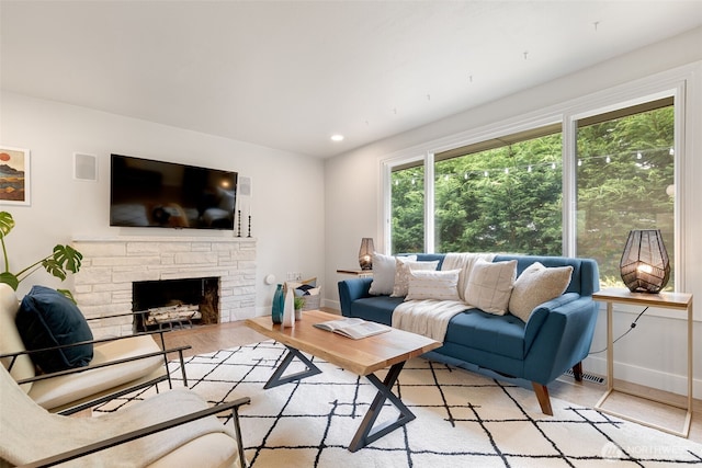 11803 14th Ave S, Seattle, WA 98168 - living room with a fireplace, recessed lighting, and light wood-style flooring