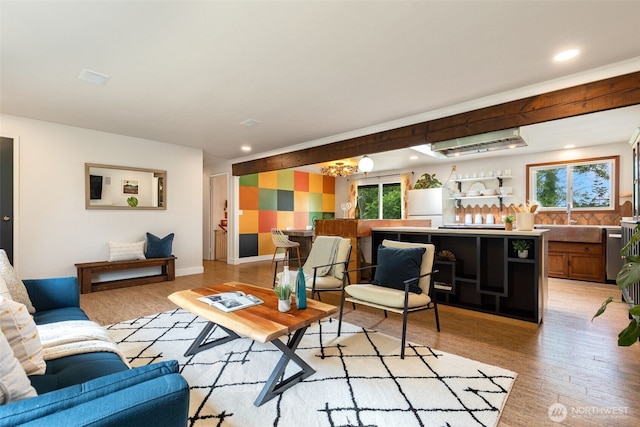 11803 14th Ave S, Seattle, WA 98168 - living area with a wall mounted air conditioner, healthy amount of natural light, light wood finished floors, recessed lighting, and a chandelier