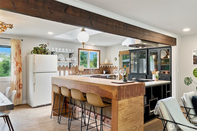11803 14th Ave S, Seattle, WA 98168 - kitchen featuring freestanding refrigerator, plenty of natural light, open shelves, recessed lighting, and a breakfast bar