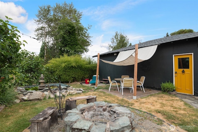 11803 14th Ave S, Seattle, WA 98168 - view of yard featuring a fire pit and a patio area
