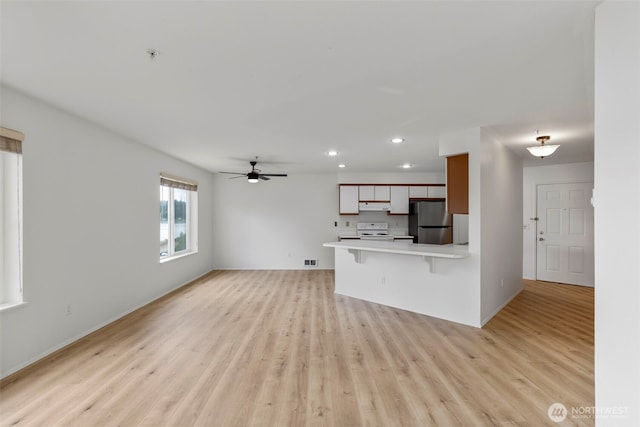 2255 Highview Ln W Unit D101, Bremerton, WA 98312 - unfurnished living room featuring recessed lighting, light wood-style flooring, and ceiling fan