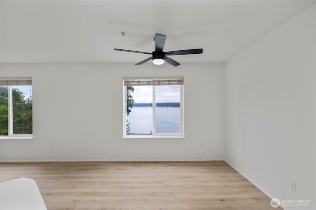 2255 Highview Ln W Unit D101, Bremerton, WA 98312 - empty room with healthy amount of natural light, ceiling fan, and light wood finished floors