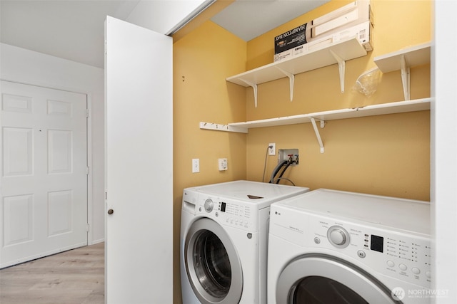 2255 Highview Ln W Unit D101, Bremerton, WA 98312 - laundry area with washer and clothes dryer and light wood-type flooring