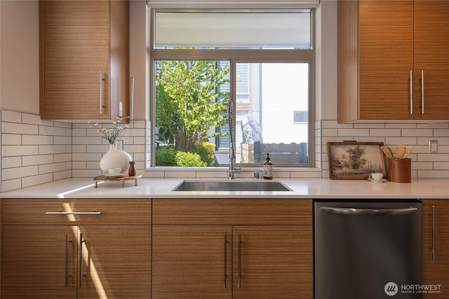2224 NW 62nd St Unit C, Seattle, WA 98107 - kitchen featuring stainless steel dishwasher, brown cabinets, and light countertops