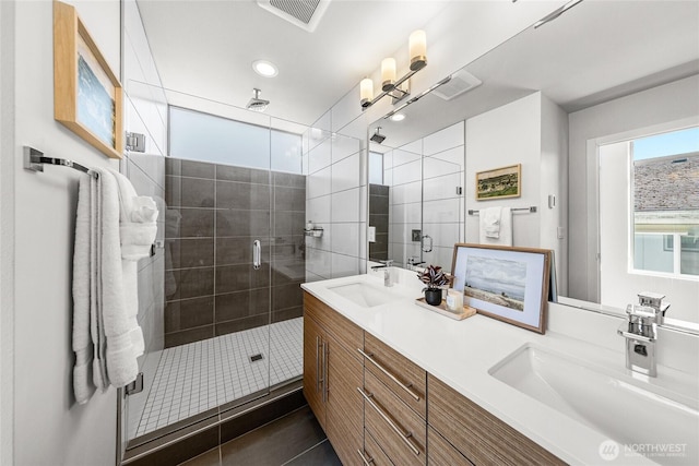 2224 NW 62nd St Unit C, Seattle, WA 98107 - full bath featuring double vanity, a stall shower, recessed lighting, and tile patterned floors