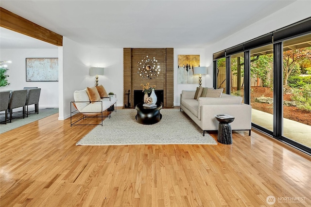 9101 SE 57th St, Mercer Island, WA 98040 - living area featuring wood finished floors and a brick fireplace