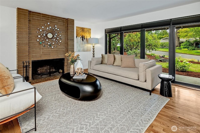 9101 SE 57th St, Mercer Island, WA 98040 - living room featuring wood finished floors and a brick fireplace