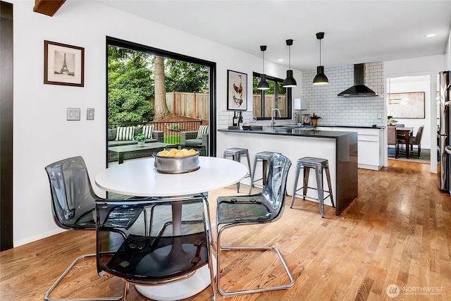 9101 SE 57th St, Mercer Island, WA 98040 - dining space featuring light wood-style floors and baseboards