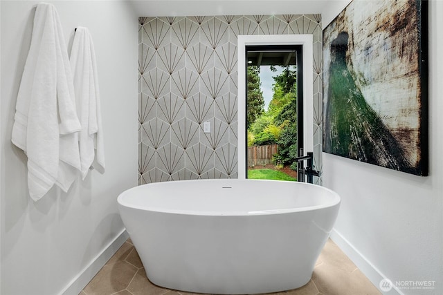 9101 SE 57th St, Mercer Island, WA 98040 - bathroom featuring a soaking tub, wallpapered walls, an accent wall, and tile patterned floors