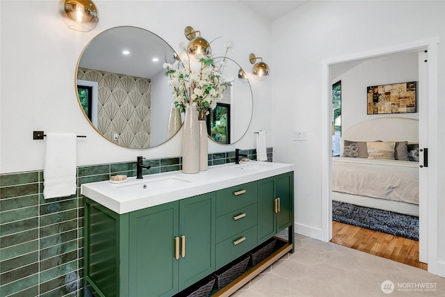 9101 SE 57th St, Mercer Island, WA 98040 - bathroom featuring ensuite bathroom, double vanity, tile patterned floors, tile walls, and recessed lighting