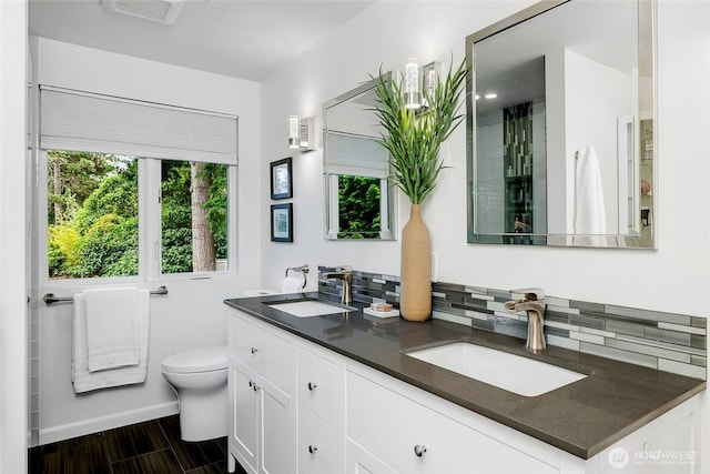 9101 SE 57th St, Mercer Island, WA 98040 - bathroom featuring double vanity and wood finished floors