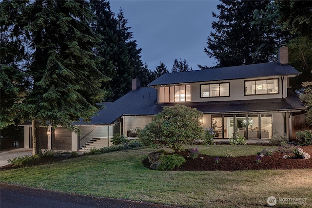 9101 SE 57th St, Mercer Island, WA 98040 - view of front of house featuring a chimney, a front yard, concrete driveway, and an attached garage