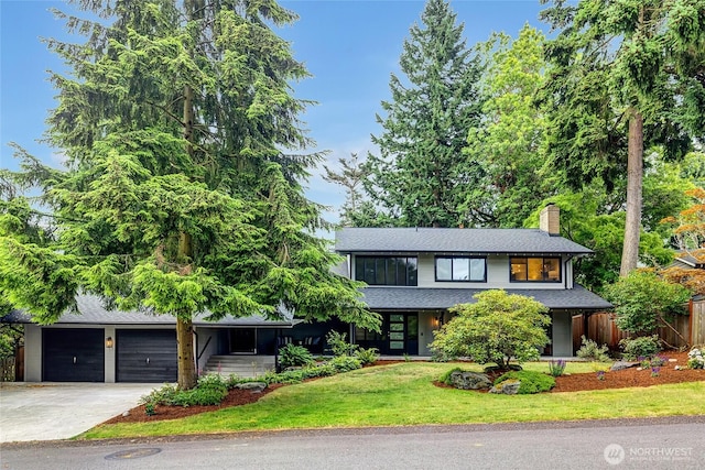 9101 SE 57th St, Mercer Island, WA 98040 - view of front of house with concrete driveway, a chimney, a garage, and a shingled roof