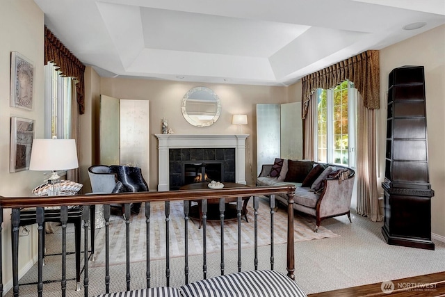 20821 NE 141st St, Woodinville, WA 98077 - living area with a raised ceiling, a tiled fireplace, and carpet flooring