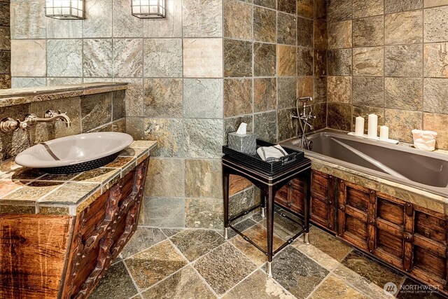 20821 NE 141st St, Woodinville, WA 98077 - full bathroom featuring tile walls, stone tile flooring, a bath, and vanity