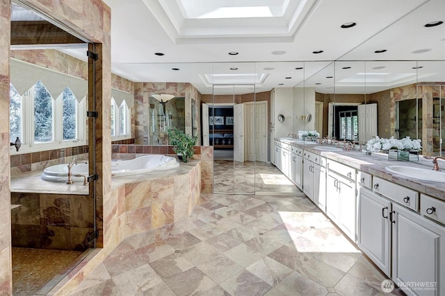 20821 NE 141st St, Woodinville, WA 98077 - bathroom with a raised ceiling, double vanity, a garden tub, a shower stall, and recessed lighting