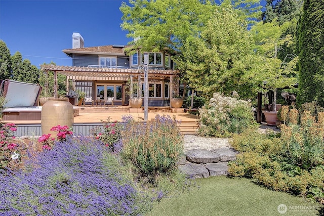 20821 NE 141st St, Woodinville, WA 98077 - back of property featuring a pergola, solar panels, a chimney, and a deck