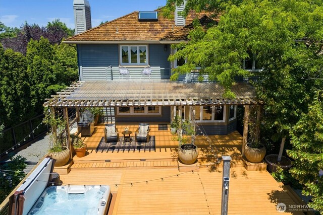 20821 NE 141st St, Woodinville, WA 98077 - back of property featuring a deck, a covered hot tub, a chimney, outdoor dining area, and a pergola