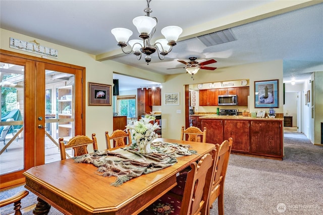 541 Surfcrest Pl NE, Poulsbo, WA 98370 - dining space featuring a chandelier, light carpet, ceiling fan, and french doors